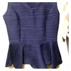 Like new, peplum top with back zipper detail